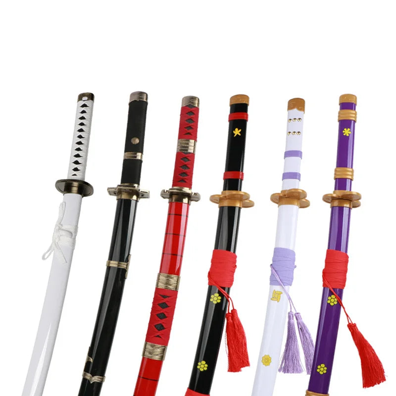 A set of five One Piece Roronoa Zoro katana wooden swords with black and red hilts and purple accents.