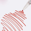 A close-up view of a white marker pen with a red line drawn on a white surface.