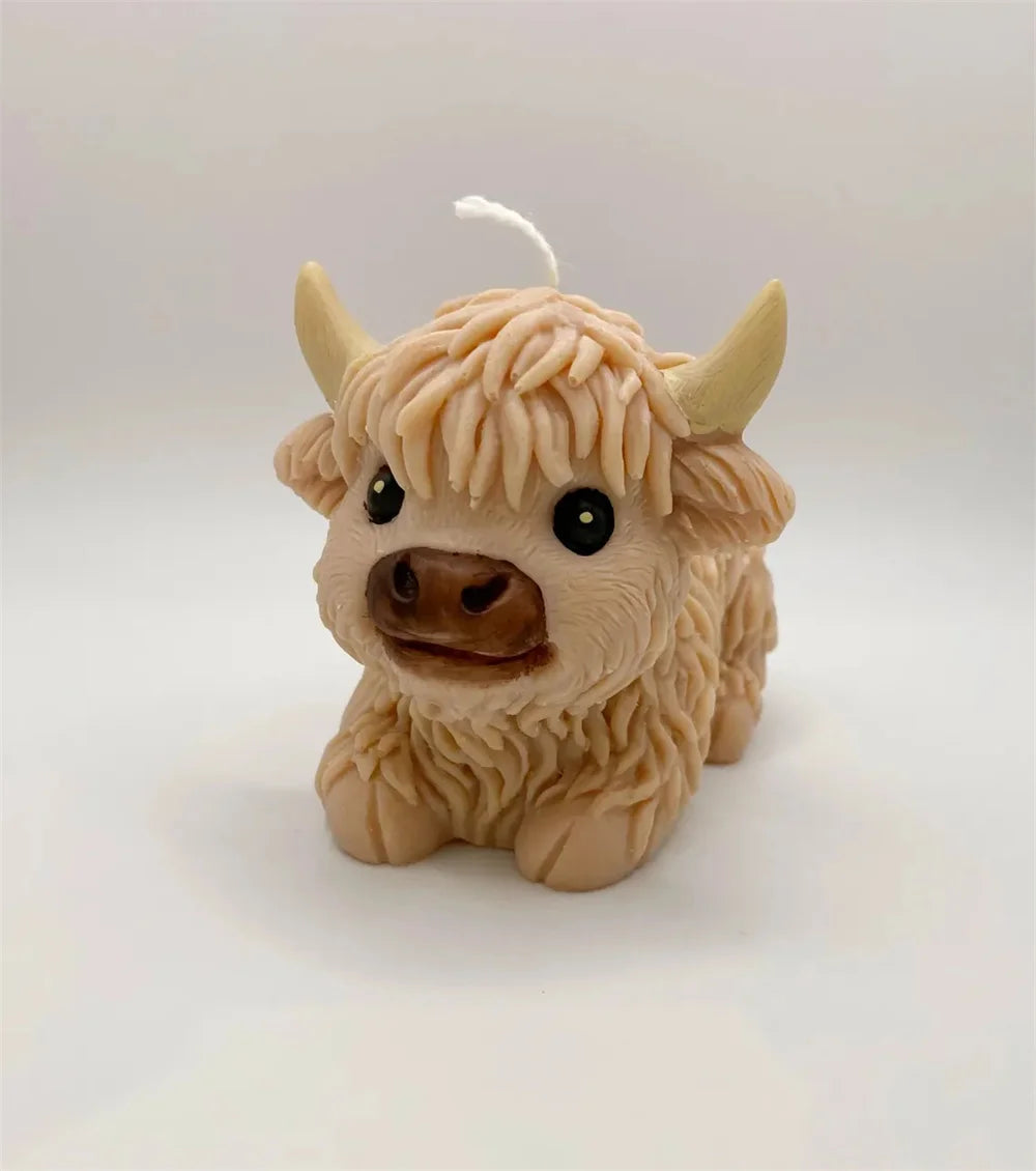 A light beige silicone mold shaped like a Highland cow head for crafting.