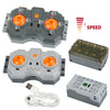 A set of power functions motors and servos for building blocks, including various components and a power supply.