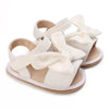 Pair of white breathable baby first walker sandals with soft anti-slip soles