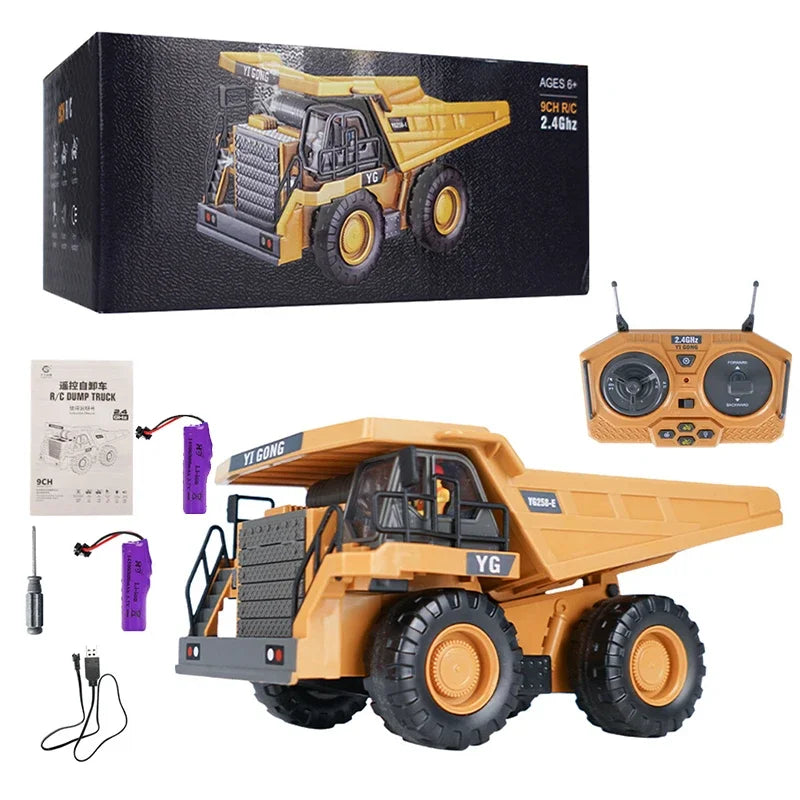 A yellow remote control excavator toy with a dump truck attachment and various accessories.