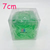 A clear plastic container holds a green, squishy stress ball scented with coconut oil.