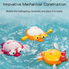 A set of wind-up swimming bath toys featuring ducks and other animals floating in blue water.