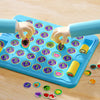A hand is playing an Animal Flip Chess Game on a blue board with colorful animal pieces and dice.