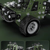 A detailed model of an off-road vehicle built from metal building blocks, featuring large tires and a visible drivetrain.