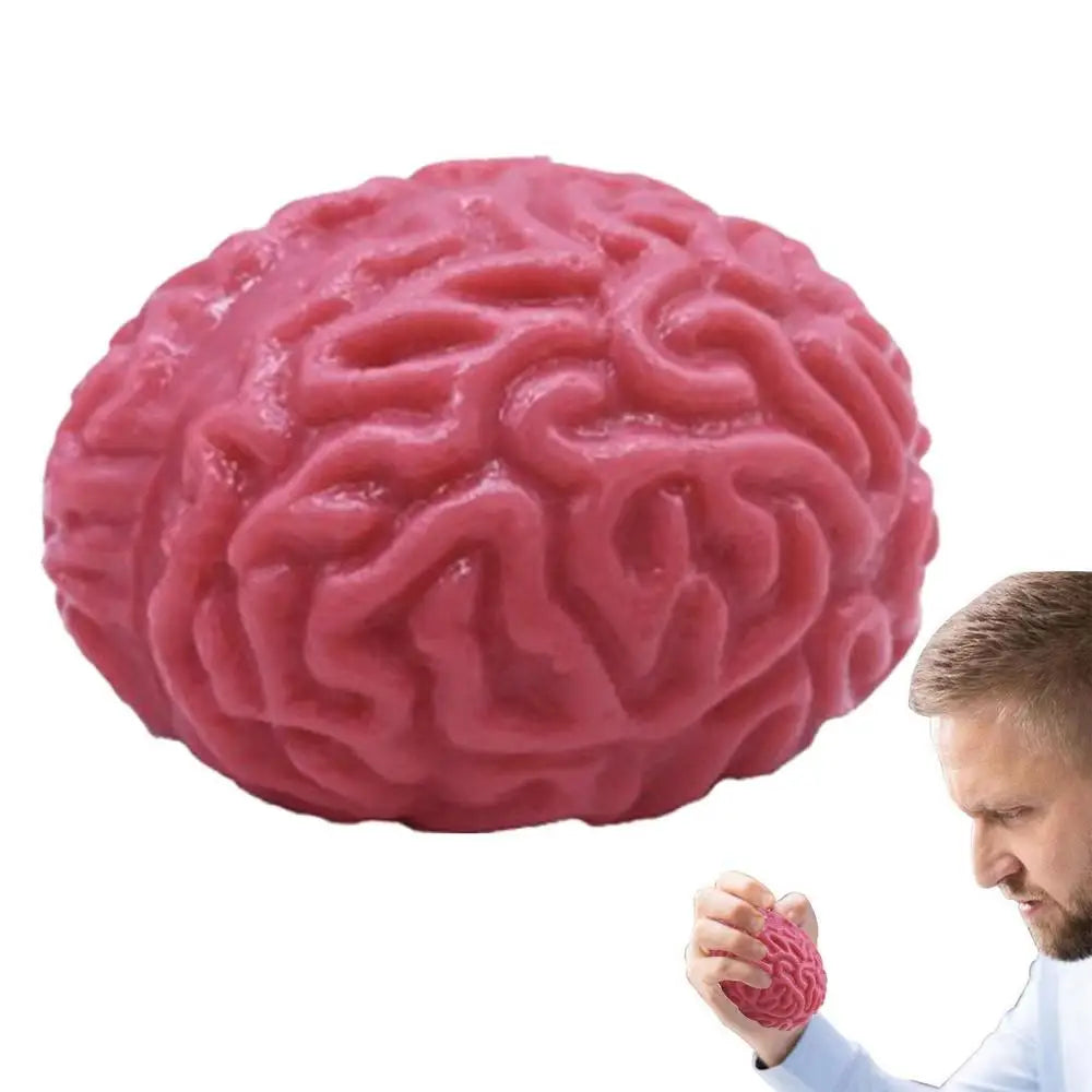 A pink, brain-shaped stress relief ball is being held by a man.
