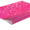Close-up of bright pink sparkling rhinestone adhesive tape rolled up for DIY crafts and decor