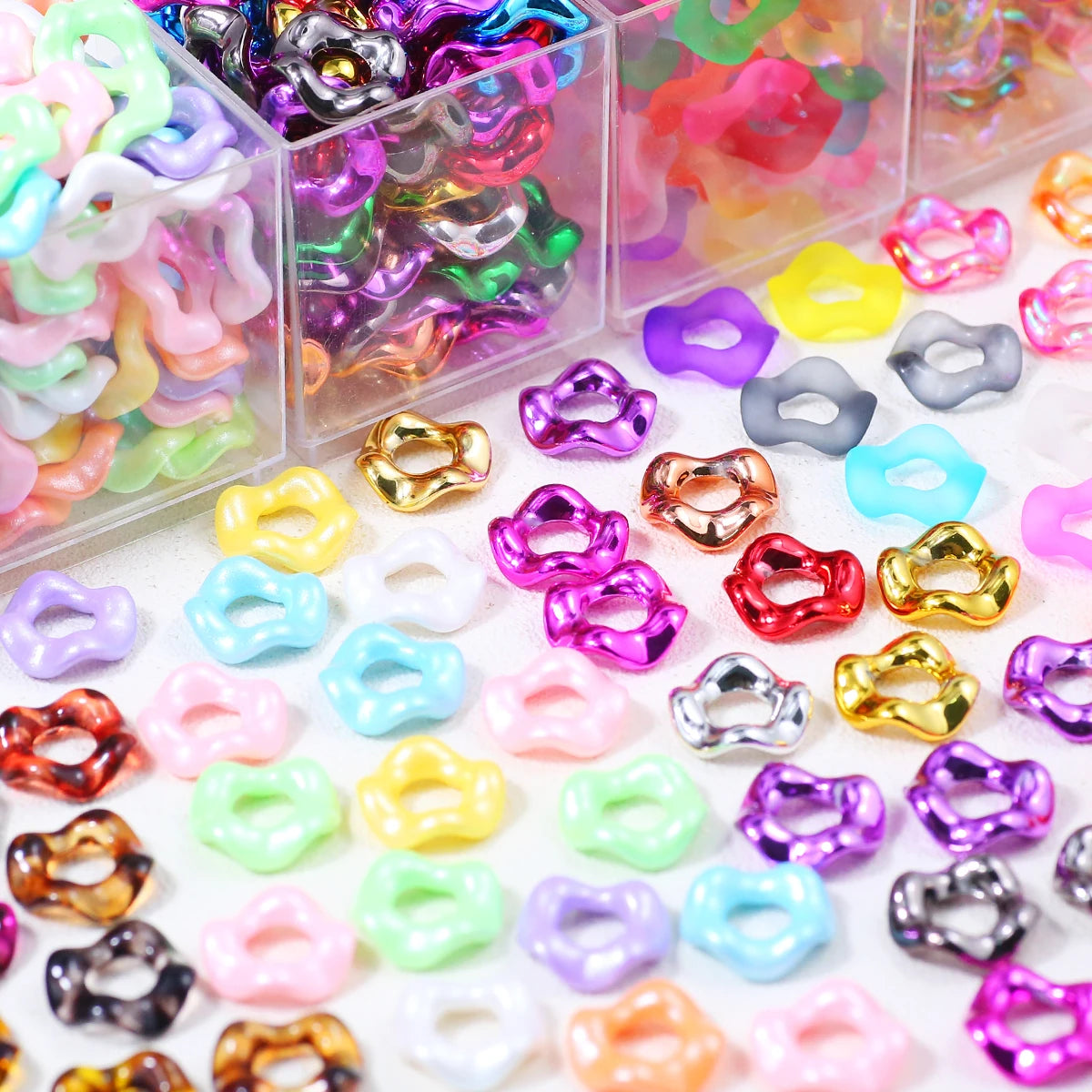 A collection of colorful wave-patterned acrylic beads in various shades and sizes for jewelry making.