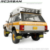A yellow RC Range Rover with a roof rack and mud flaps, shown for the FCX10 Range Rover upgrade kit.