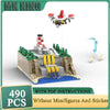 A 490-piece construction kit featuring a UFO robot model and a detailed landscape built from building blocks.