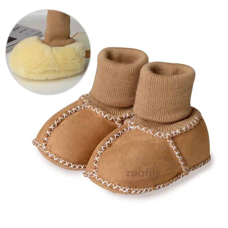 Pair of tan suede baby booties with ribbed cuffs and a plush fur lining shown next to a close-up of the lining.