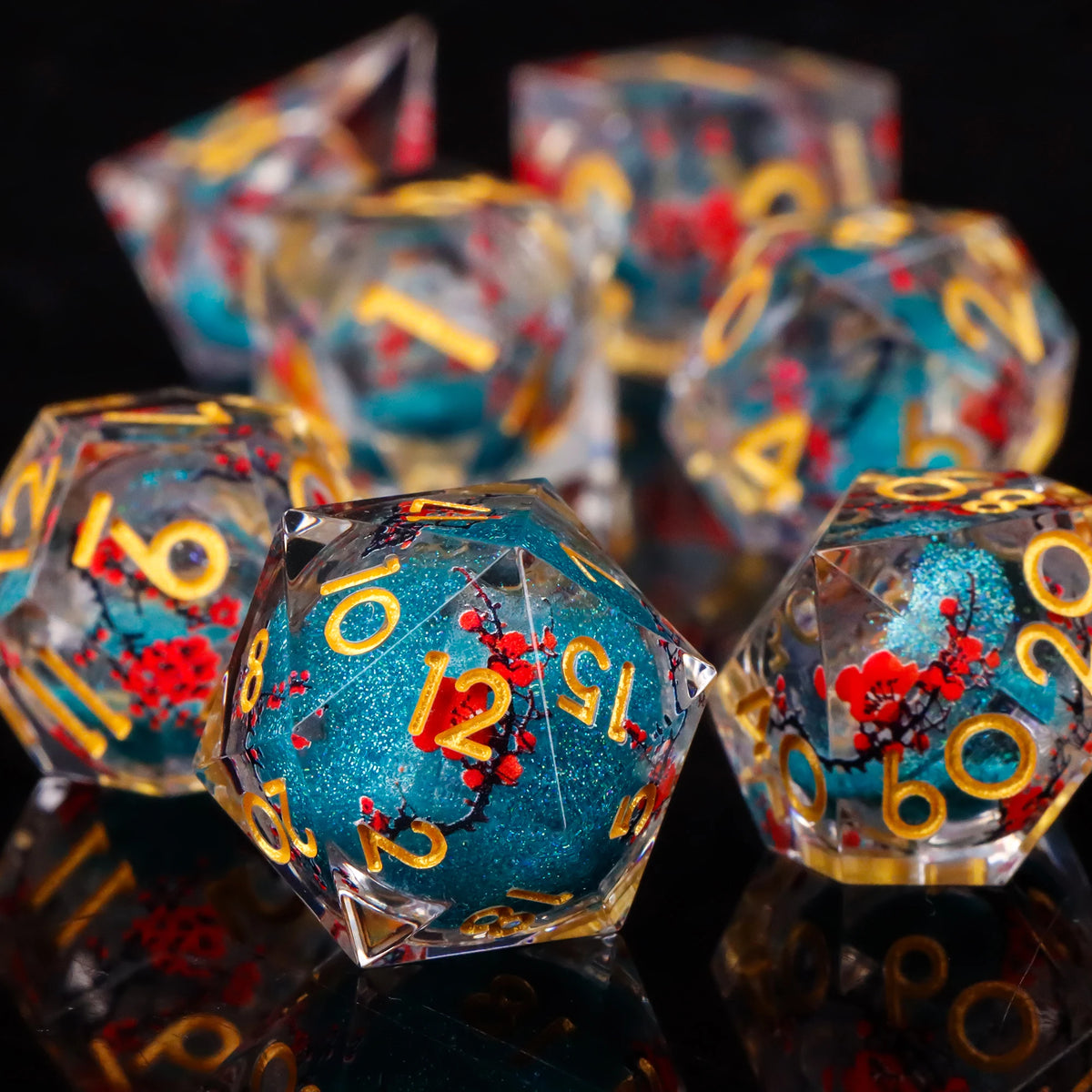 A collection of translucent resin dice in shades of blue and red, reflecting light on a dark surface.