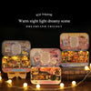 Box theatre set featuring various miniature scenes and furniture for a dreamland trilogy
