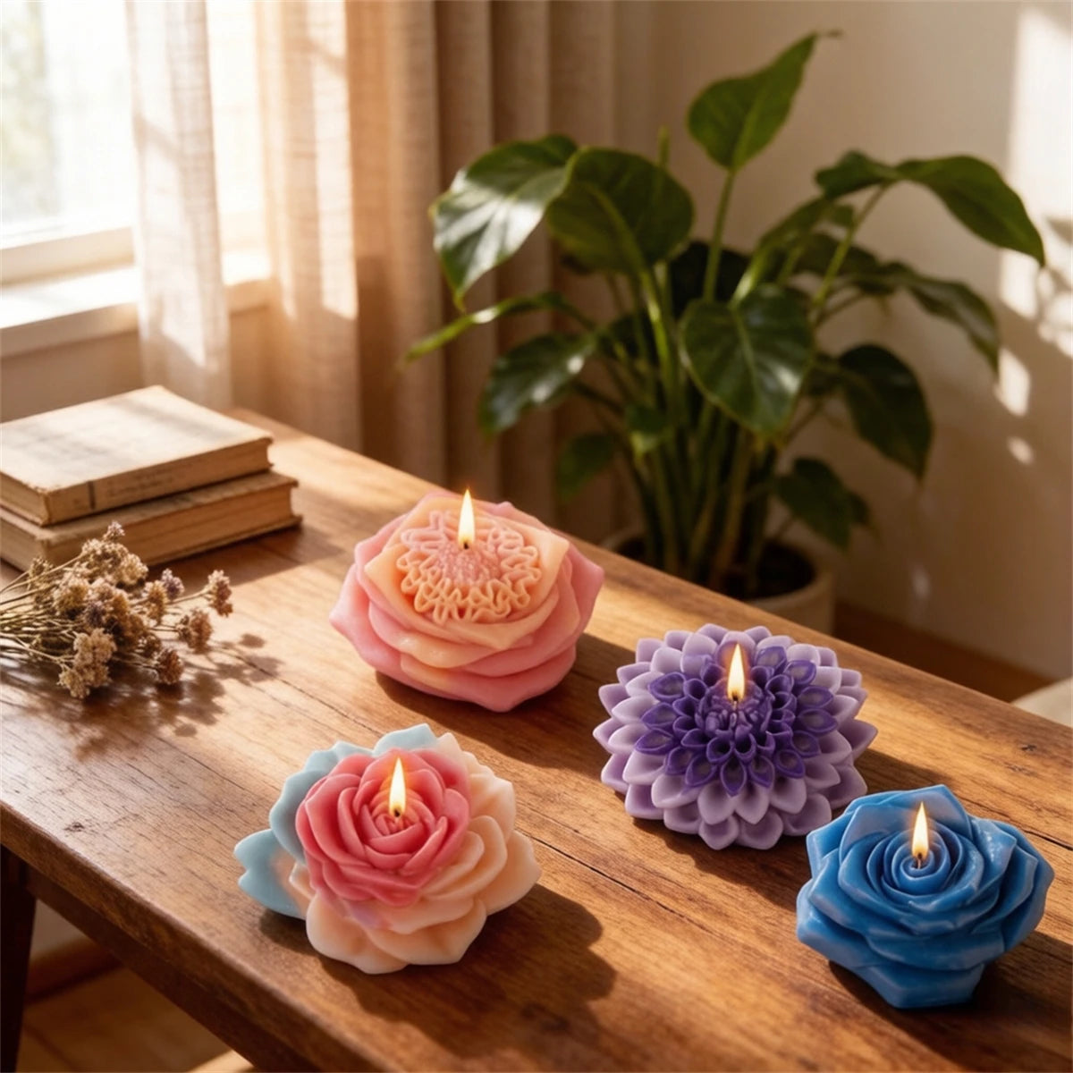 Pink and blue floral silicone candle molds displayed on a wooden surface with a green plant in the background.