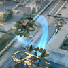 A green electric RC fighter plane performing a 360 degree rolling flight maneuver against a blurred background.