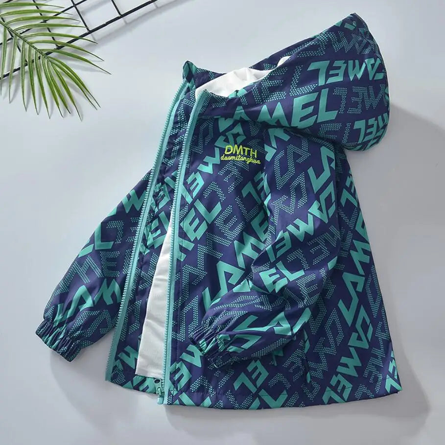 A dark blue and teal waterproof winter jacket for kids with a hood, displayed on a white surface.