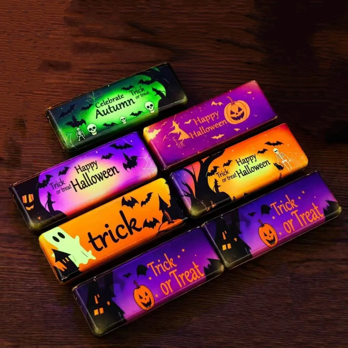 A collection of eight Halloween-themed squishy stress toys in various colors and designs.