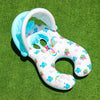 A light blue inflatable pool lounger for two with a sun canopy and backrest resting on green grass.