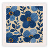 A square piece of fabric featuring a blue and orange floral pattern created with punch needle embroidery.