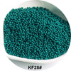 A pile of teal glass seed beads in a white bowl.