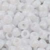 A pile of small, white pony beads for jewelry making and crafts.