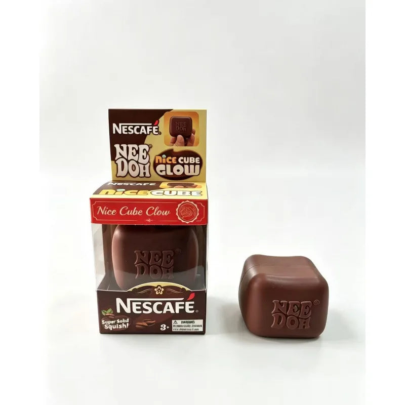 A box and a brown squishy fidget toy of the Needoh Nice Cube Glow brand.
