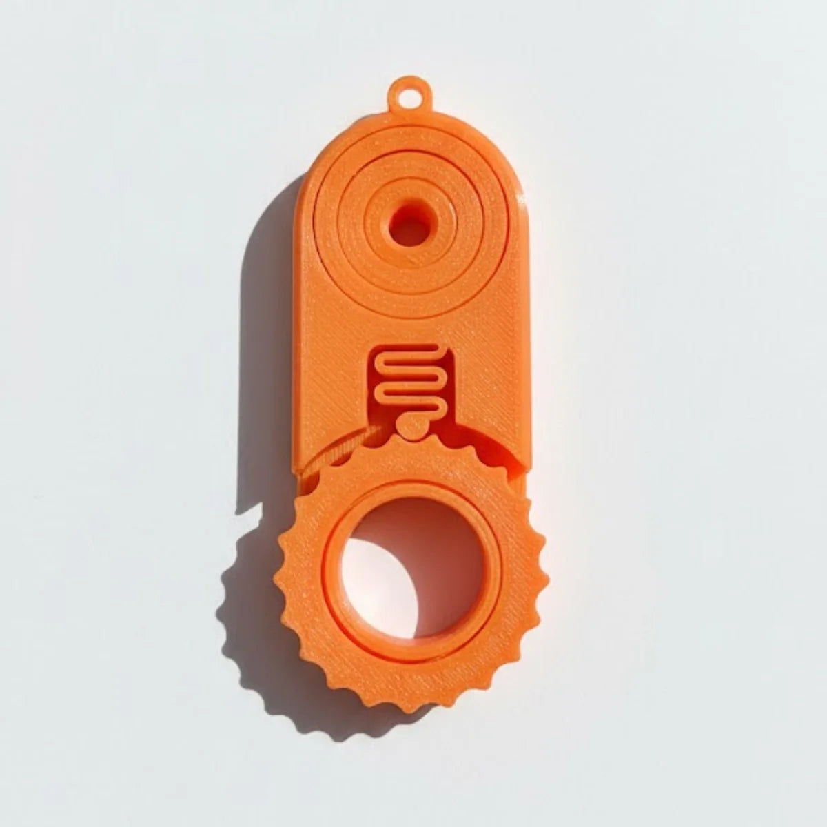 Orange 2-in-1 fidget clicker and spinner keychain for stress relief