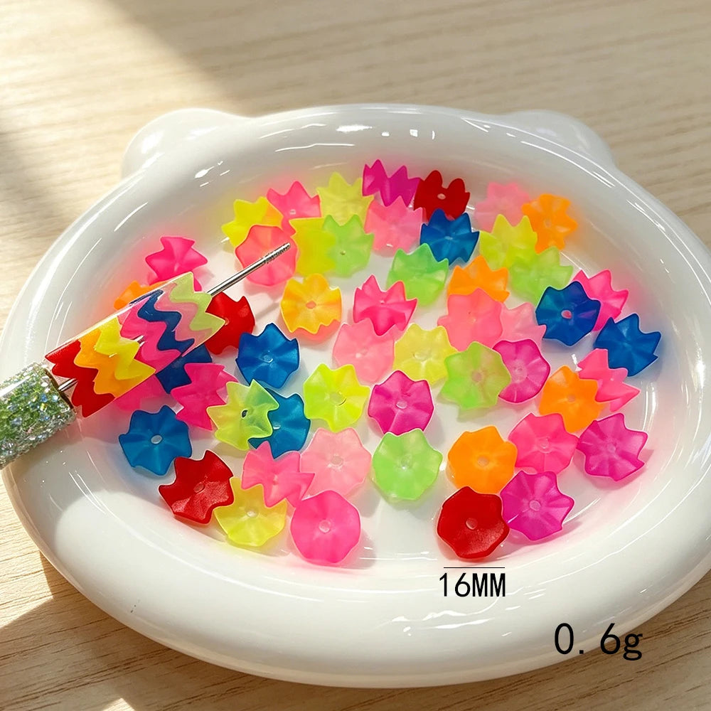 A pile of 300 translucent beads in various colors like pink, yellow, green, and blue is displayed on a white dish.