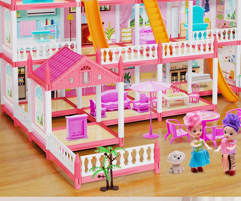 A pink and purple miniature castle and villa playset featuring multiple levels, stairs, and colorful furniture.