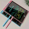 A pink and blue LCD writing tablet displaying happy emojis and a green stylus pen.