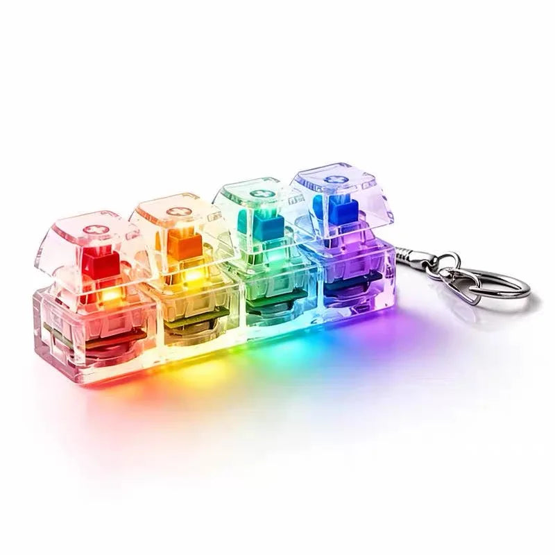 A set of four colorful LED light-up keyboard fidget toys arranged in a row.