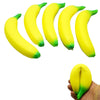 A cluster of bright yellow banana-shaped squishy toys with green tips.