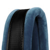 Close-up of a dark blue accordion strap with a black mesh section on a soft fabric background.