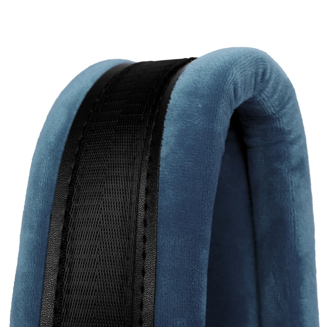 Close-up of a dark blue accordion strap with a black mesh section on a soft fabric background.
