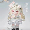 A white collectible figurine of a girl with light blonde hair and pink accents, featuring velvet flowers and a delicate dress