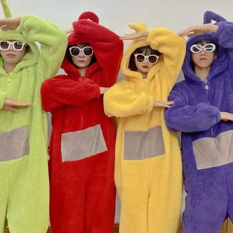 Four people wearing colorful, fuzzy, hooded pajamas inspired by the Teletubbies characters.