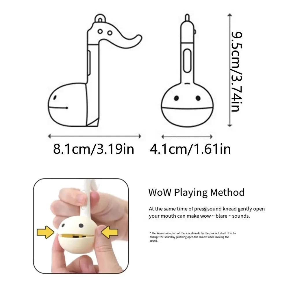 A diagram showing the design and dimensions of an Otamatone mini electronic musical instrument toy.