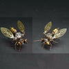Steampunk mechanical bee model kit showing a detailed insect-like figure with gold and silver metal parts