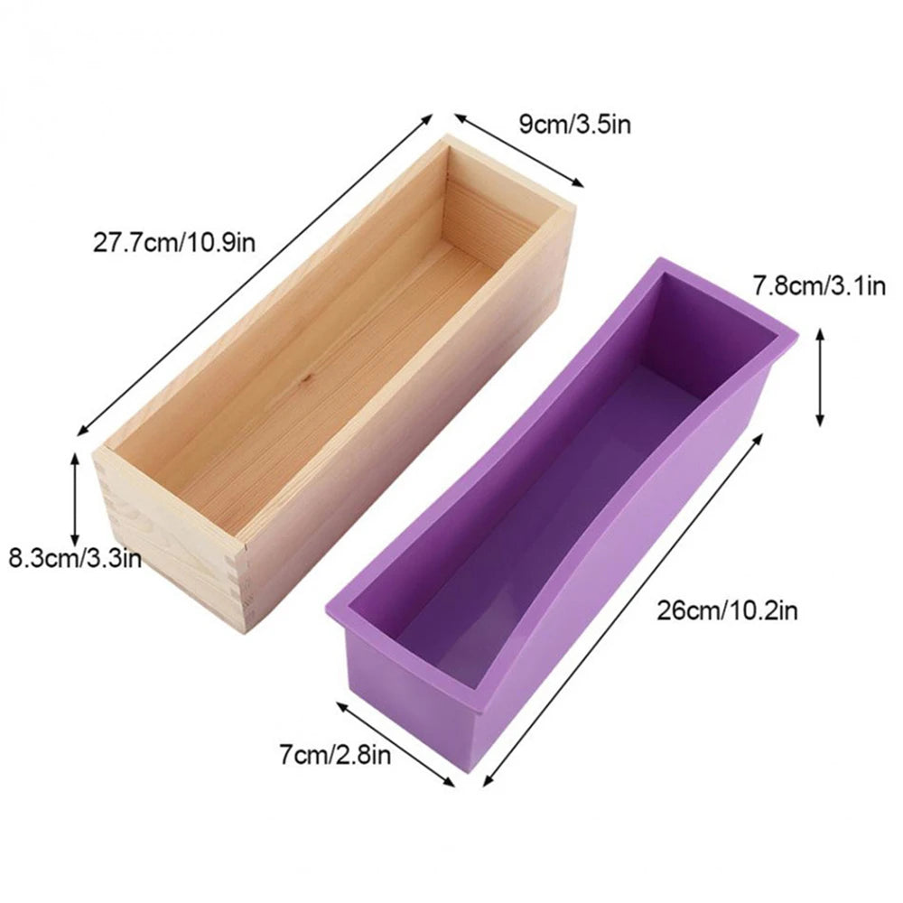 A rectangular silicone soap mold with a wooden casing and cutting knife shown in light wood and purple colors.