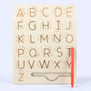 A wooden Montessori letter tracing board showing uppercase and lowercase alphabet letters for early learning.