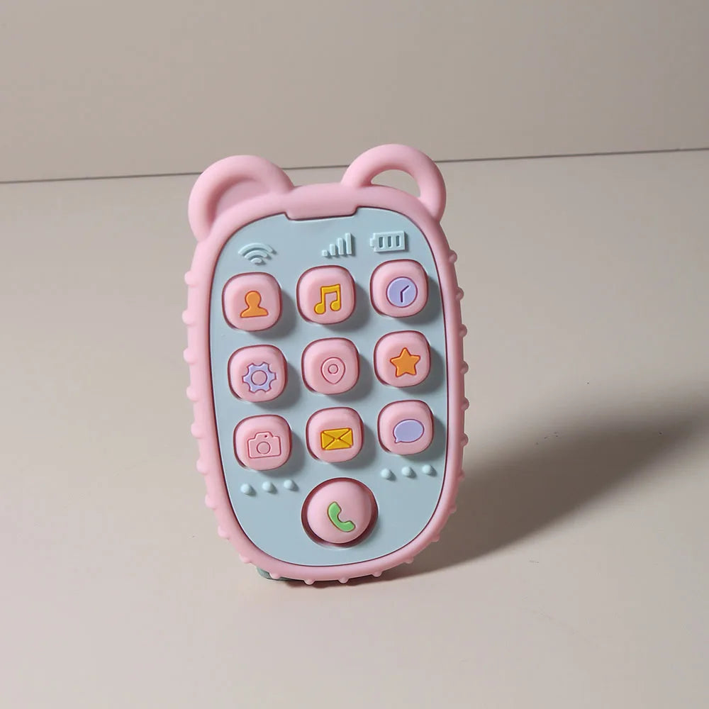 A pink phone-shaped silicone teether for babies with various buttons and features.