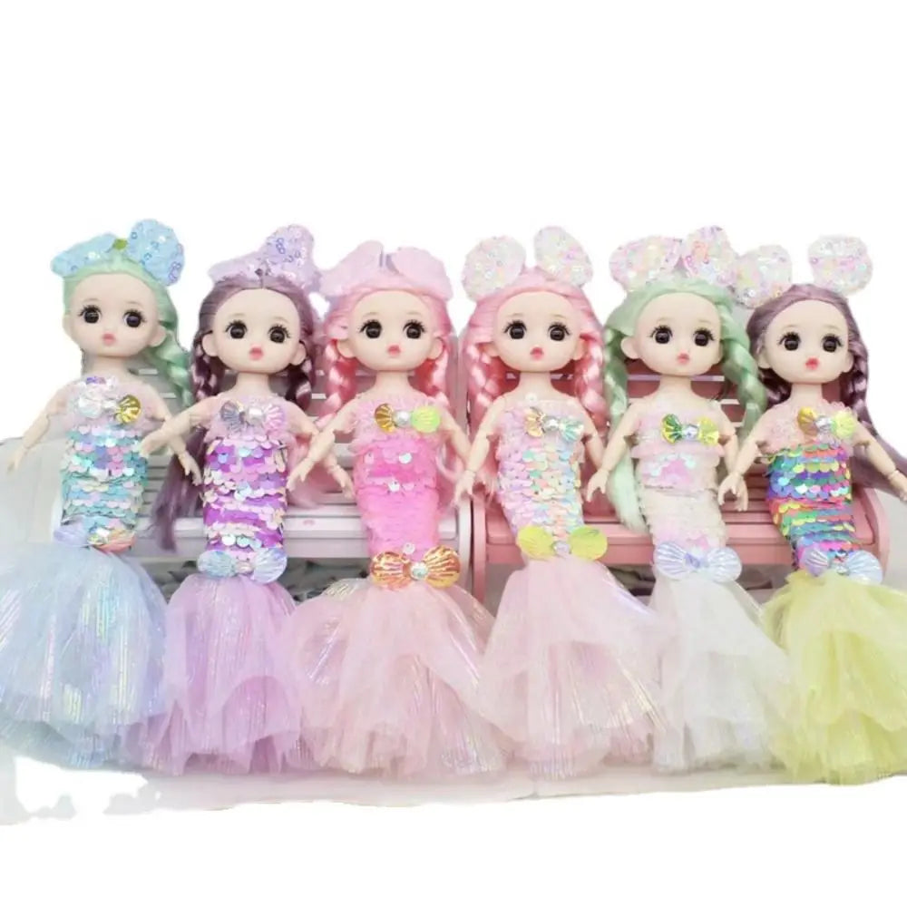 A collection of colorful sequin mermaid dolls with movable joints and wedding dresses.