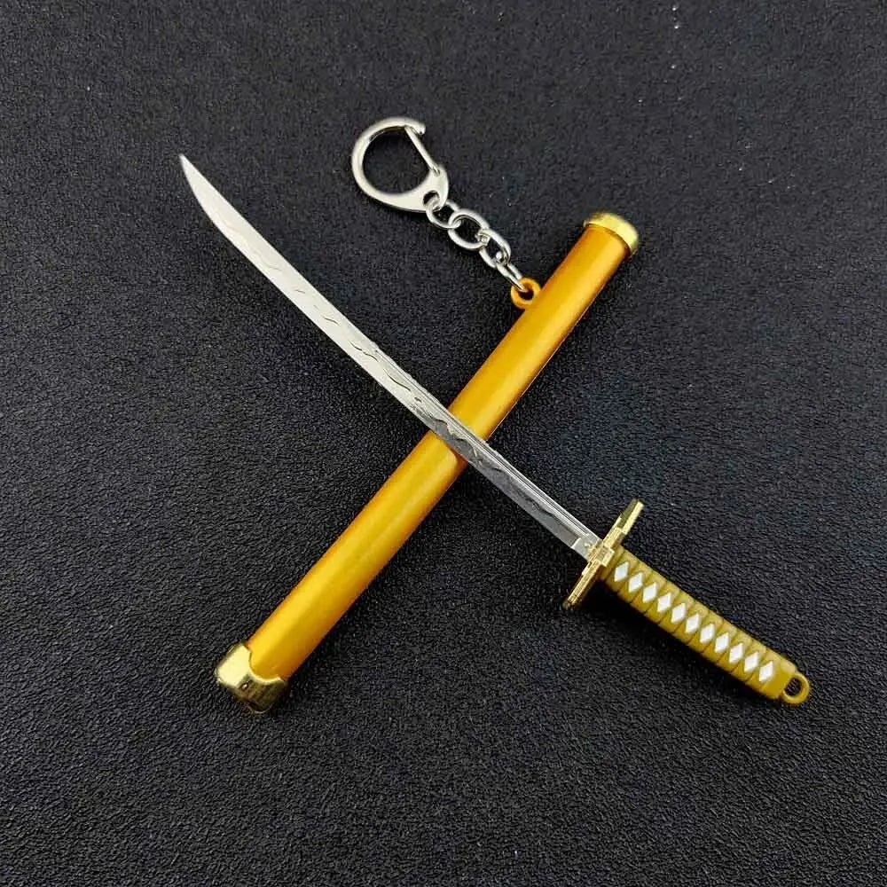 A samurai sword keychain with a yellow hilt and silver blade, featuring a decorative grip.