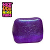 A purple glitter ice cube sensory fidget toy with the NeeDoh Nice Cube logo visible.
