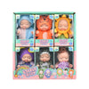 A box containing six realistic mini reborn baby dolls with various outfits and accessories.