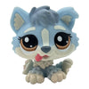 A cute bobblehead toy of a fox or canine with light blue fur and large brown eyes.