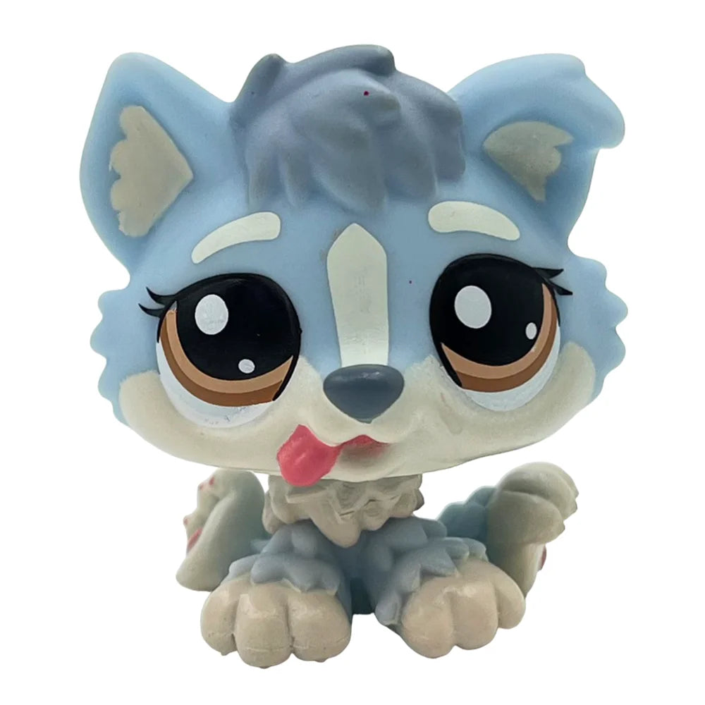 A cute bobblehead toy of a fox or canine with light blue fur and large brown eyes.