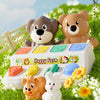 A white pop-up farm toy featuring a brown bear and a fluffy white rabbit, set in green grass.
