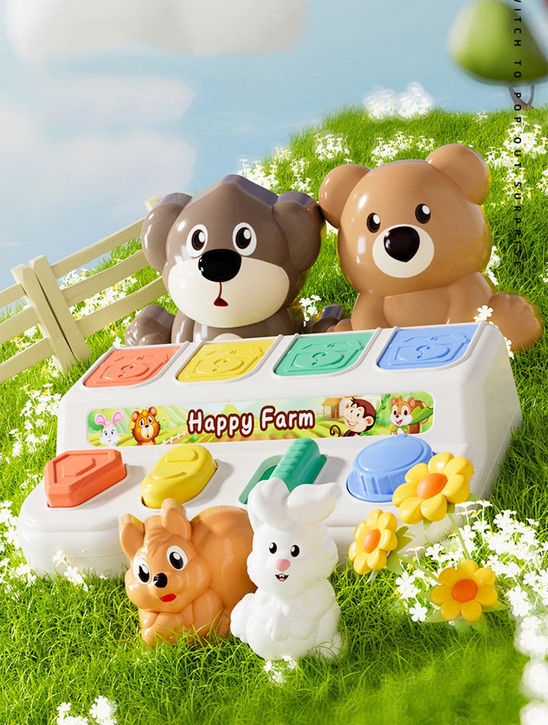 A white pop-up farm toy featuring a brown bear and a fluffy white rabbit, set in green grass.